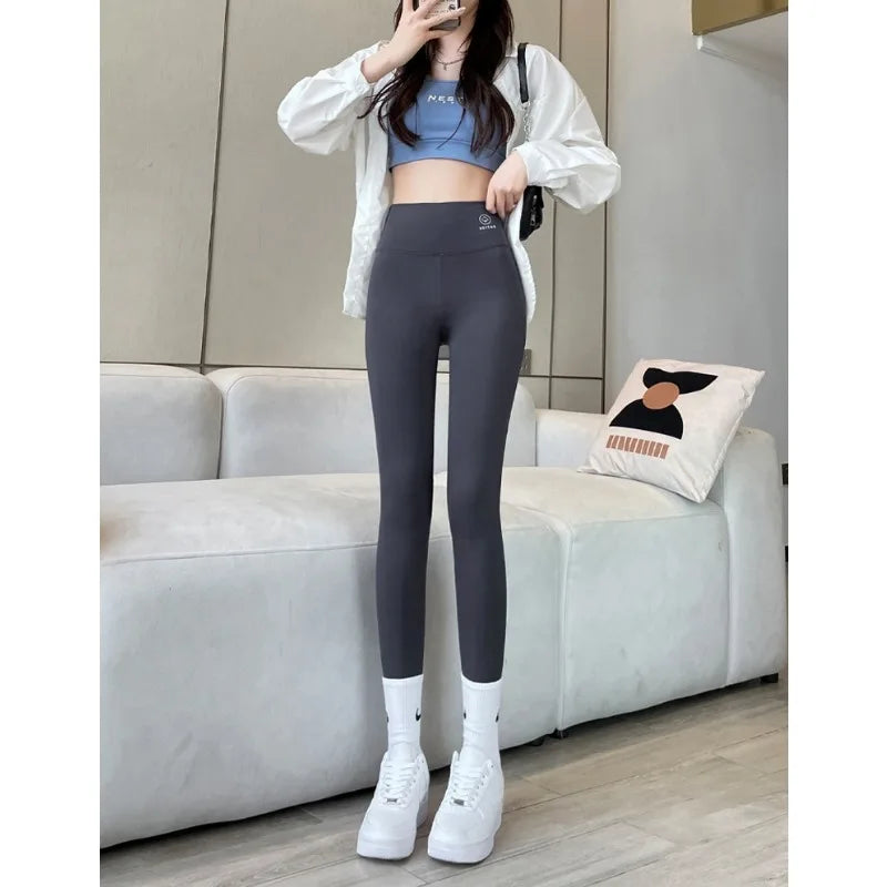 2024 Summer New Women's Solid Color Nine Points Raised Belly Buttock Shark Yoga Pants Show Tall And Thin All Matching Leggings