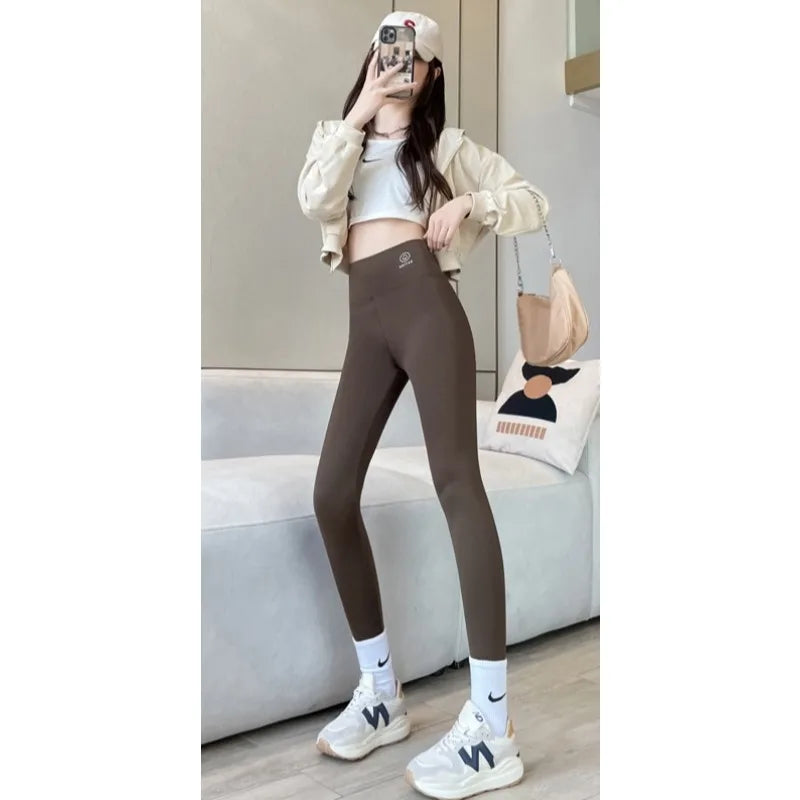 2024 Summer New Women's Solid Color Nine Points Raised Belly Buttock Shark Yoga Pants Show Tall And Thin All Matching Leggings